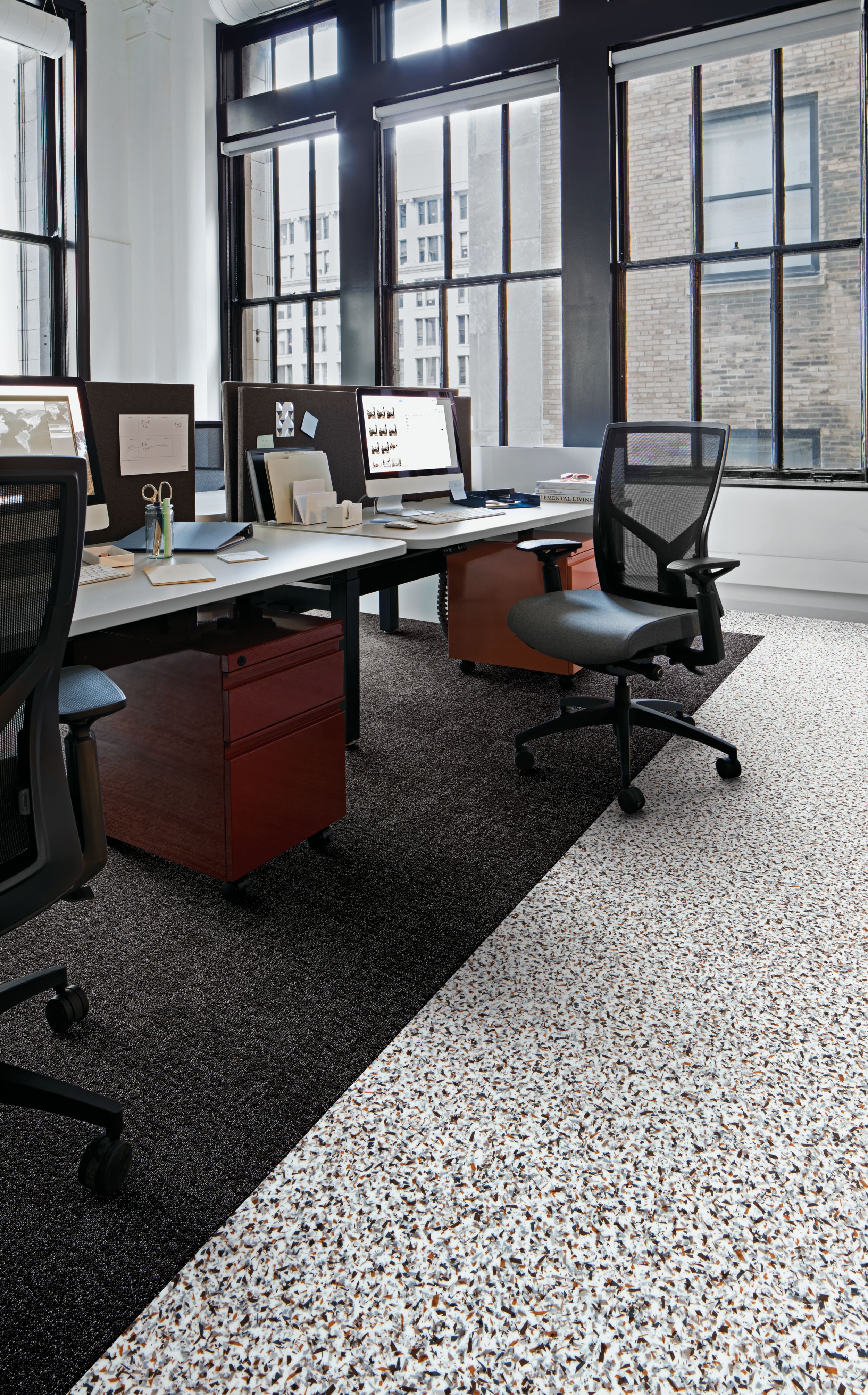 Interface Walk on By LVT and Step in Time carpet tile in cubicle area with rolling chairs imagen número 1